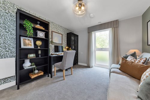 a living room with a large black cabinet