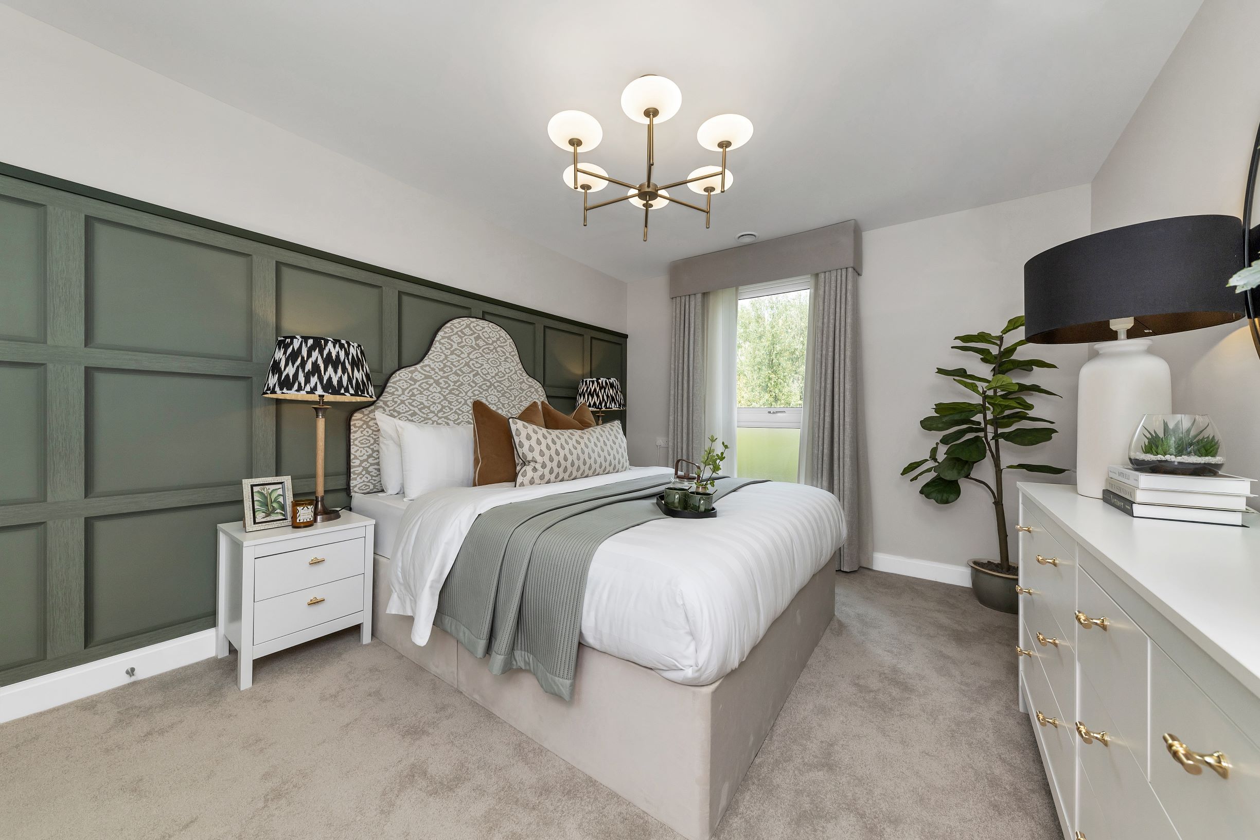 a bedroom with a bed and a lamp