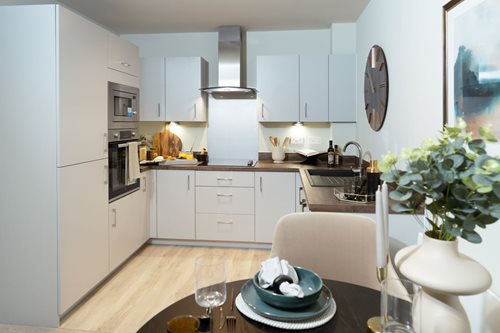 a kitchen with white cabinets