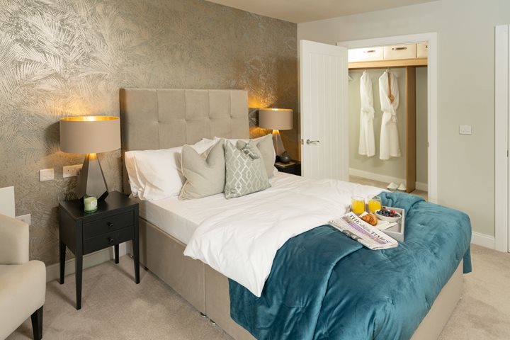 a bed with a blue comforter