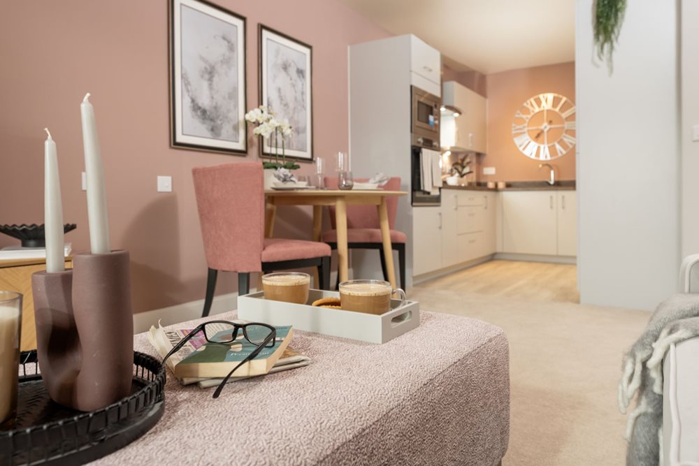 a living room with a table and chairs