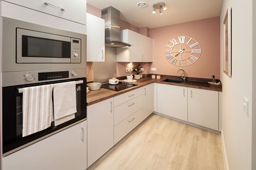a kitchen with white cabinets