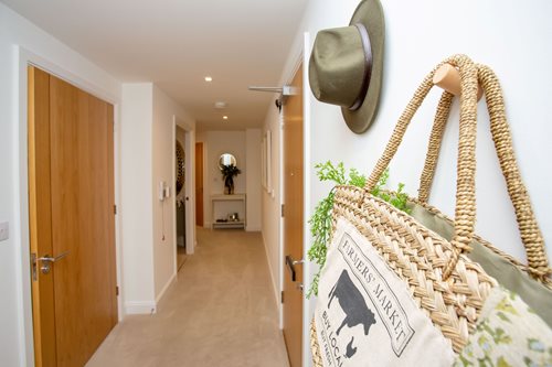a room with a bed and a hat