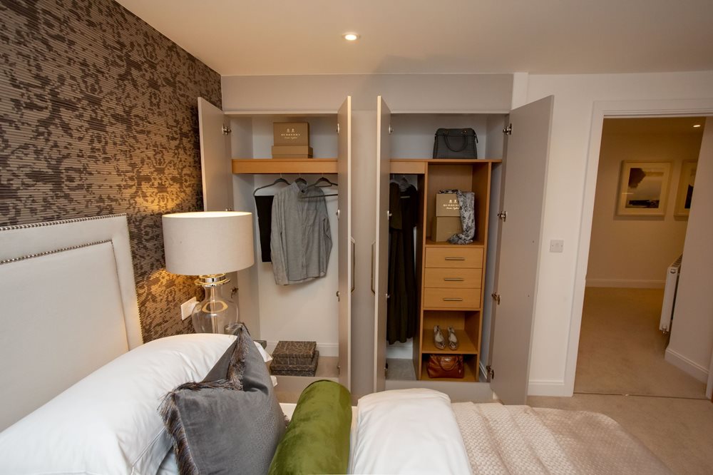 a bedroom with a closet and bed