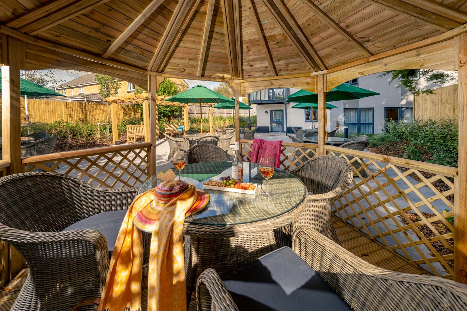a patio with a table and chairs
