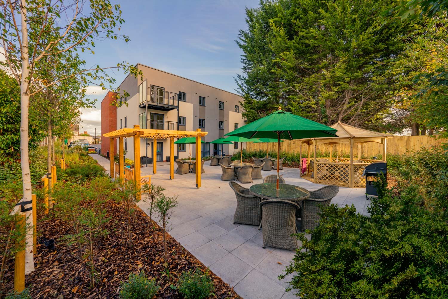 a patio with tables and chairs