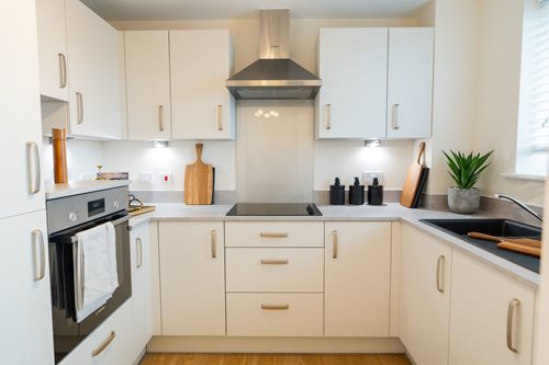 a kitchen with white cabinets