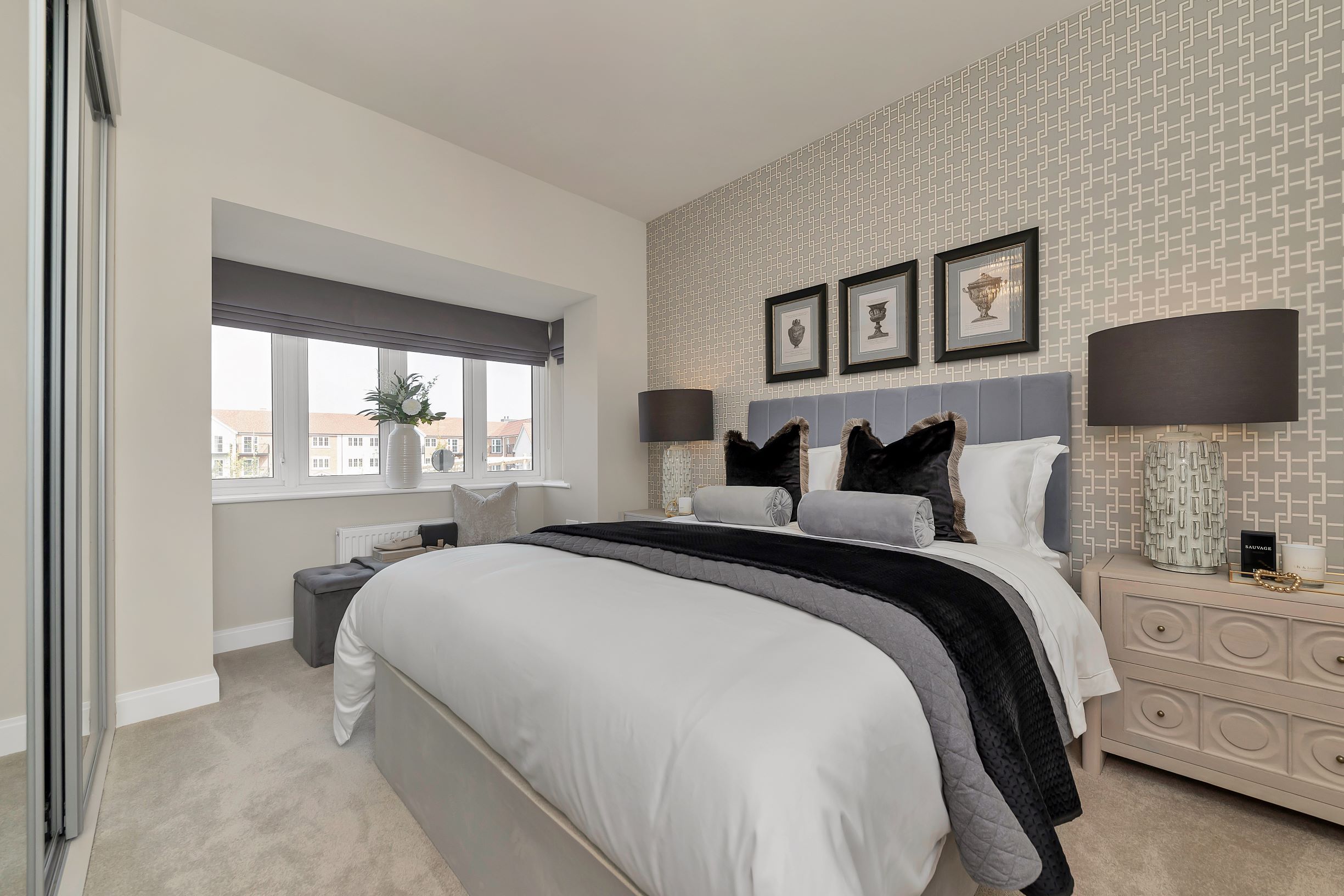 a bedroom with a bed and a window
