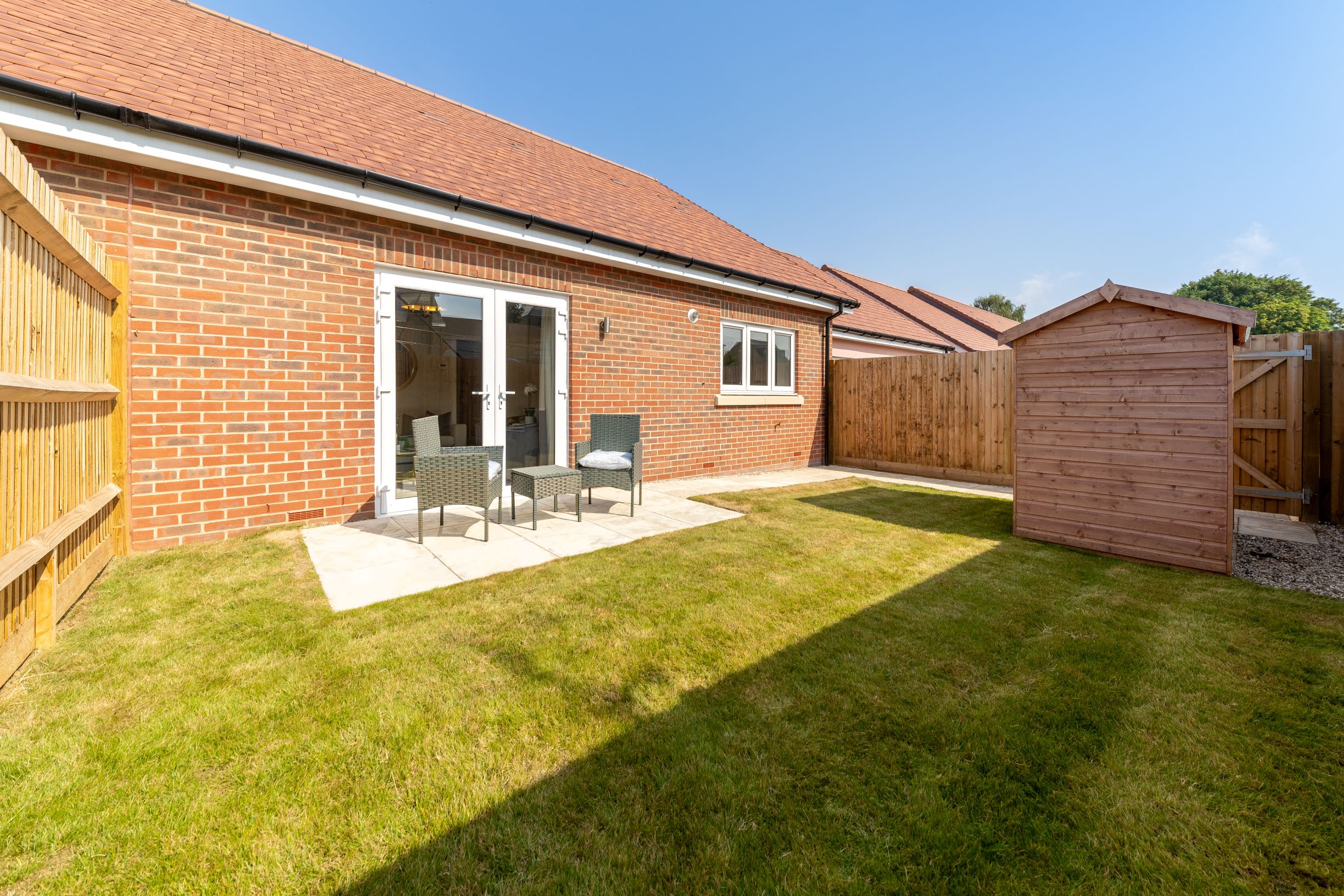 a brick house with a lawn