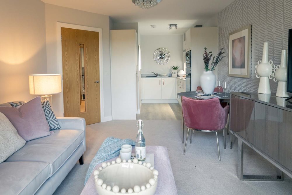 a living room with a table and chairs