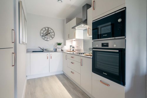 a kitchen with white cabinets