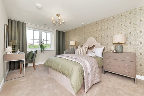 a bedroom with a bed and lamps