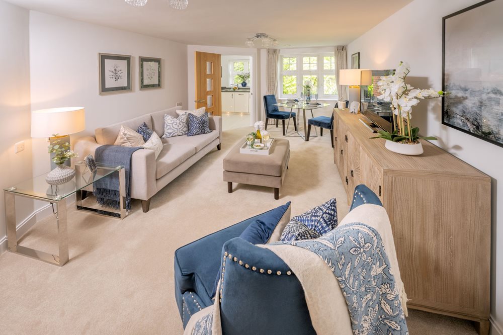 a living room with a couch and chairs