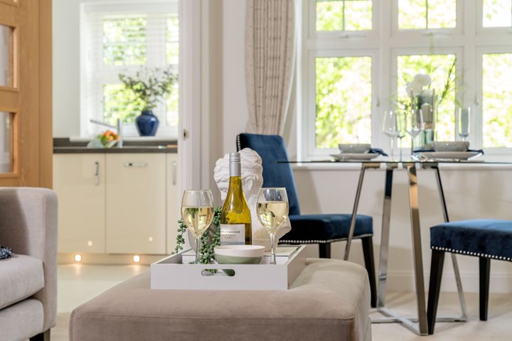 a table with wine glasses and bottles on it