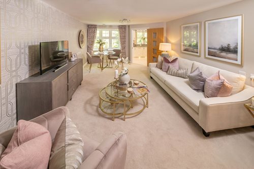 a living room with a tv and couches