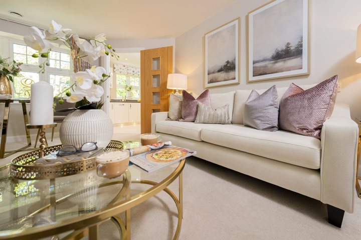 a living room with a glass coffee table and a large glass coffee table