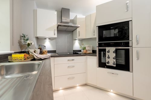 a kitchen with white cabinets