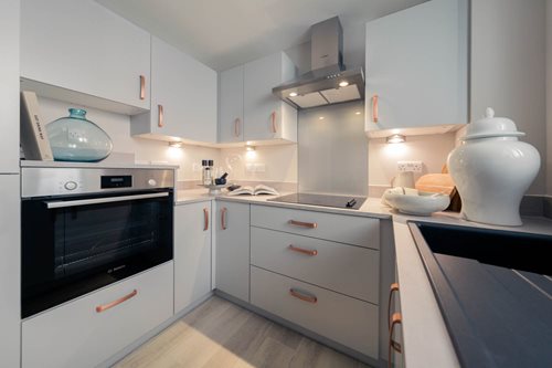 a kitchen with white cabinets