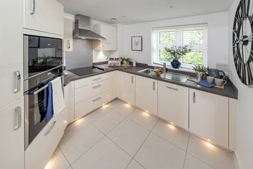 a kitchen with white cabinets