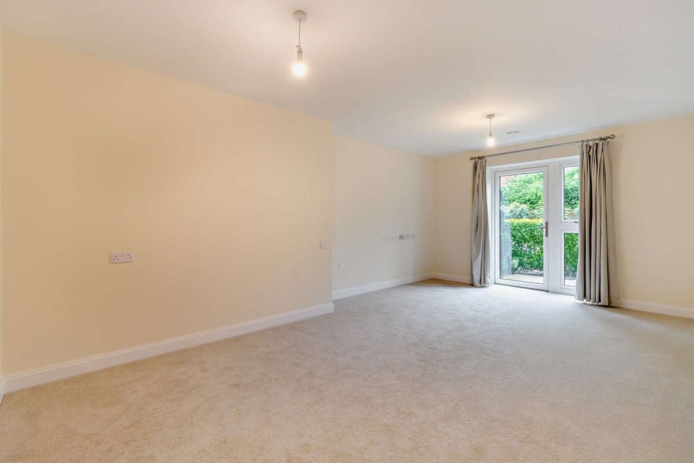 a room with a carpet and a window