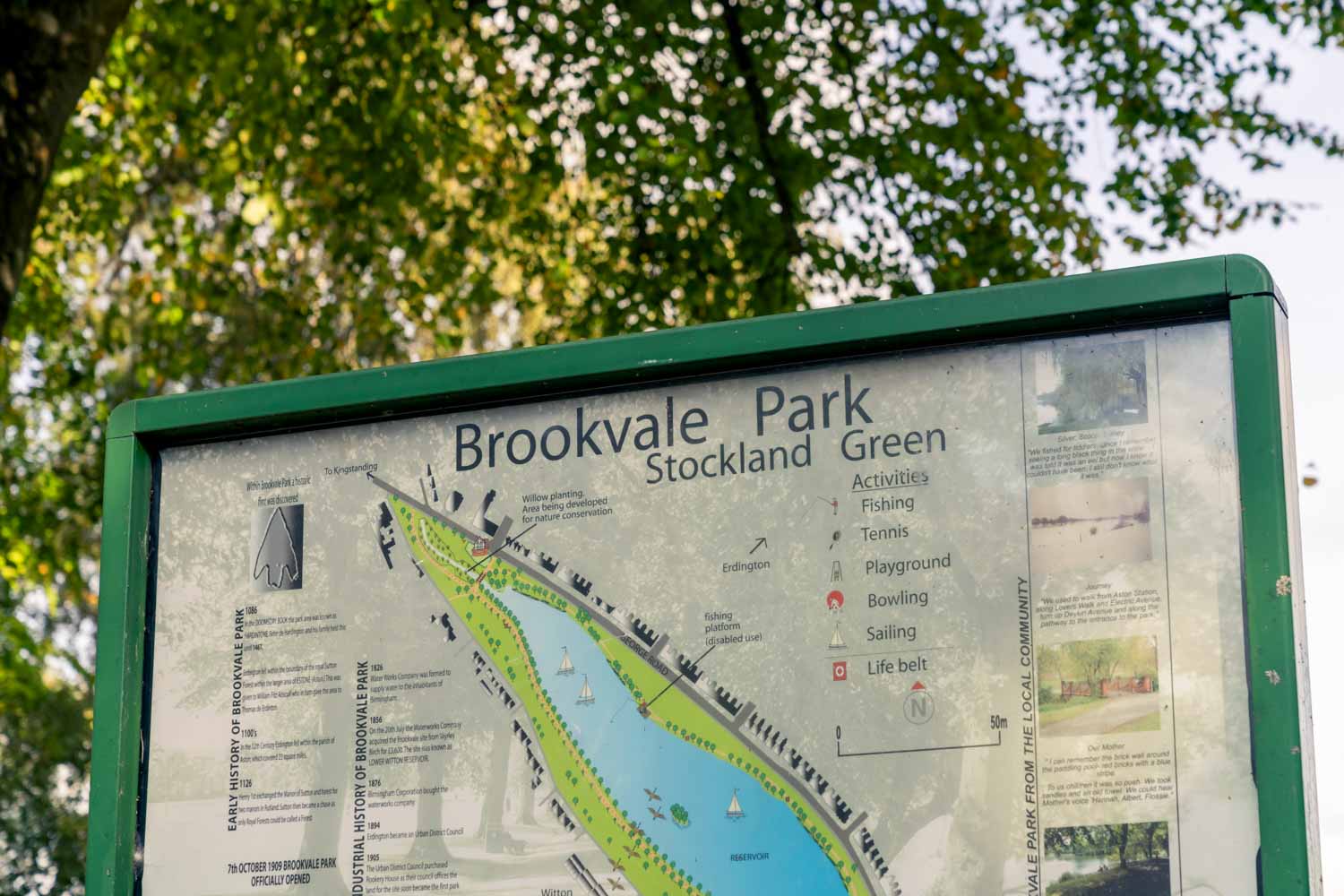 a green sign with writing on it