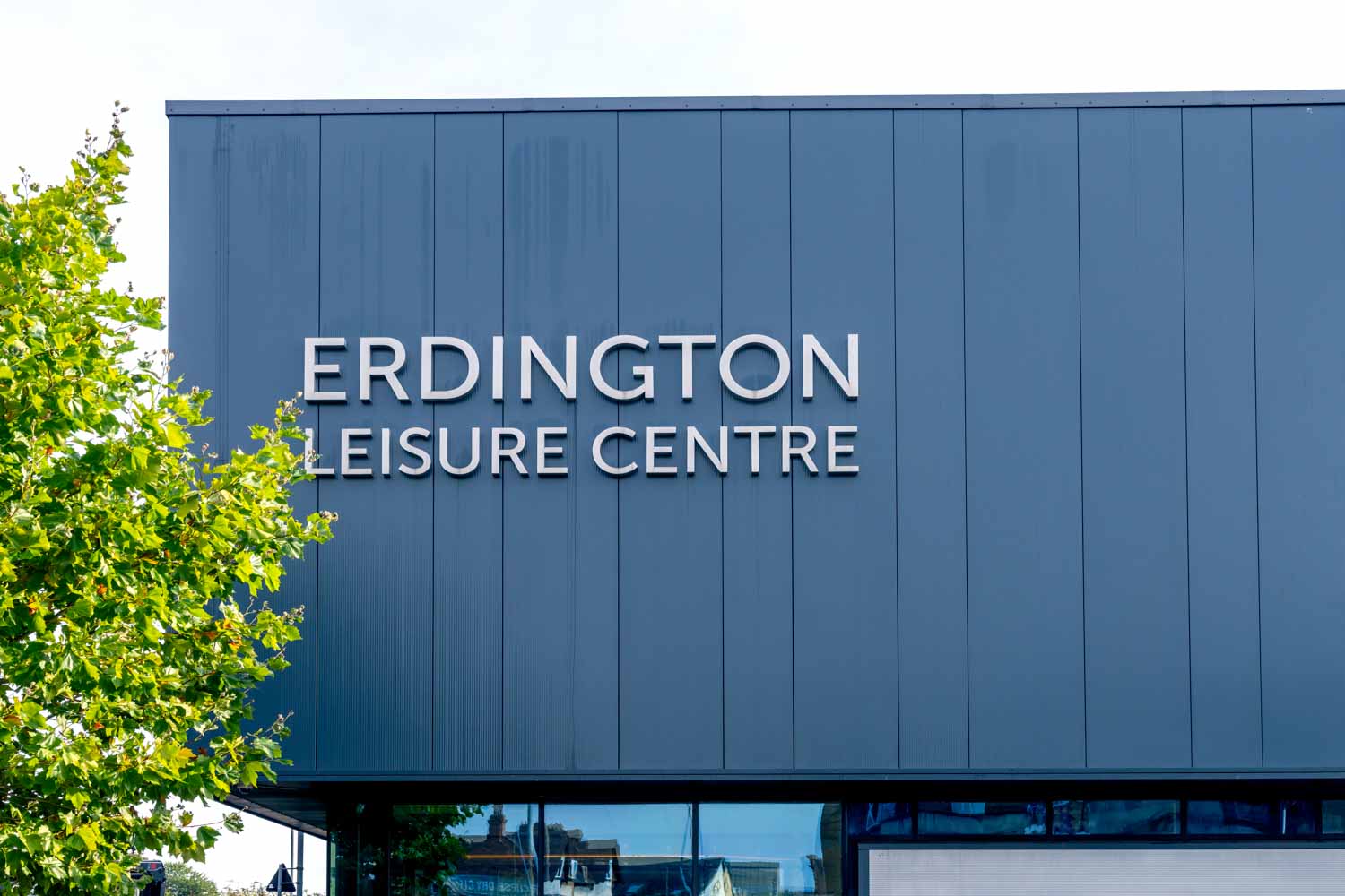 a large blue building with white text