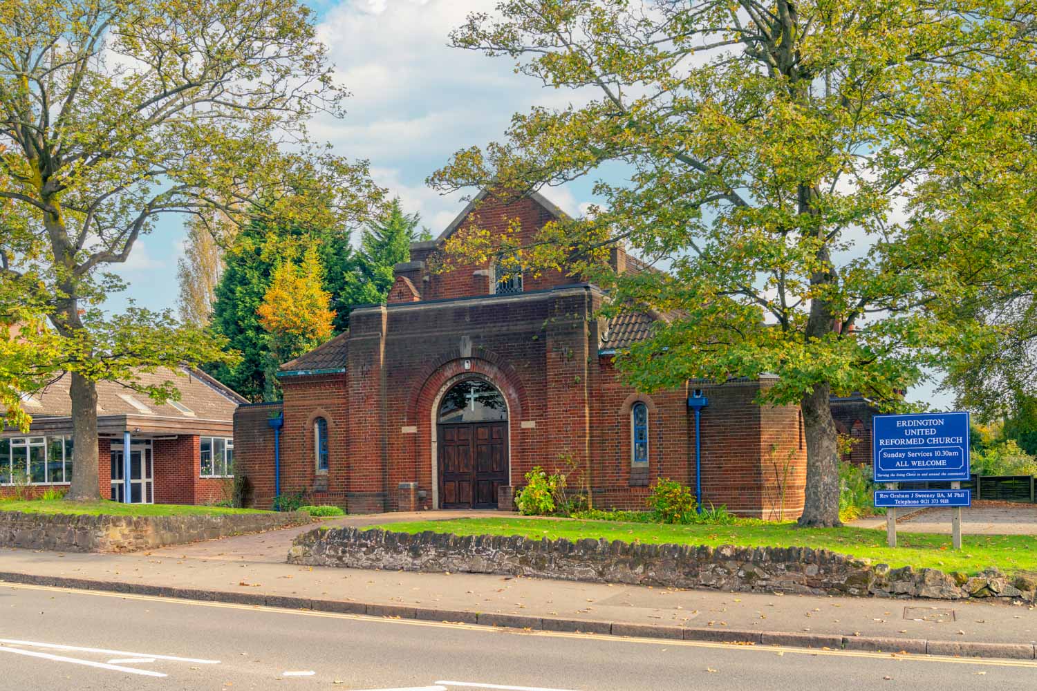 a brick building with a sign