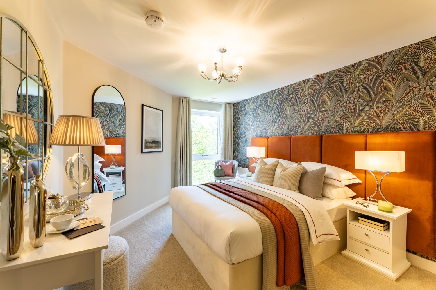 a bedroom with a bed and lamps