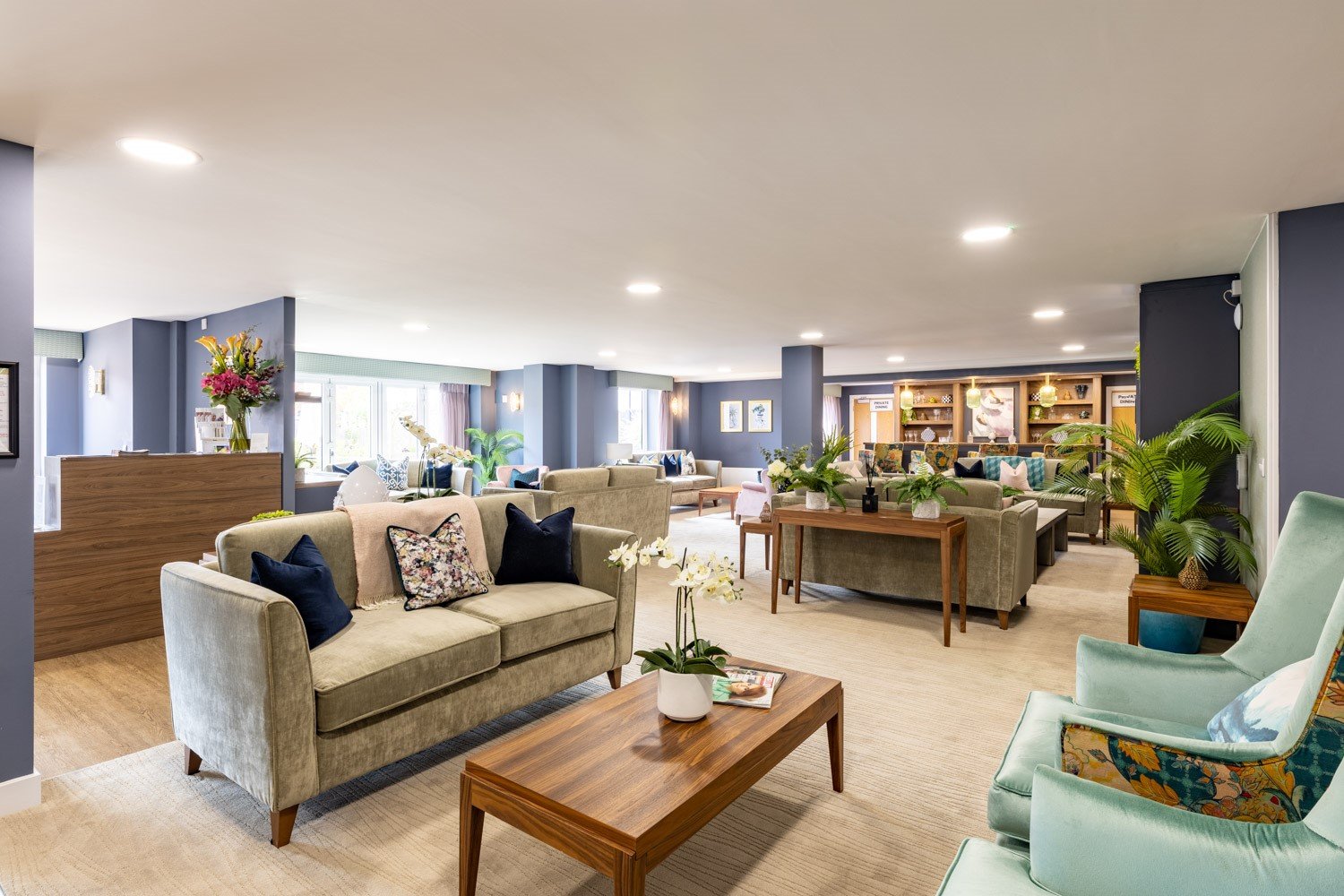 a living room with a couch and chairs