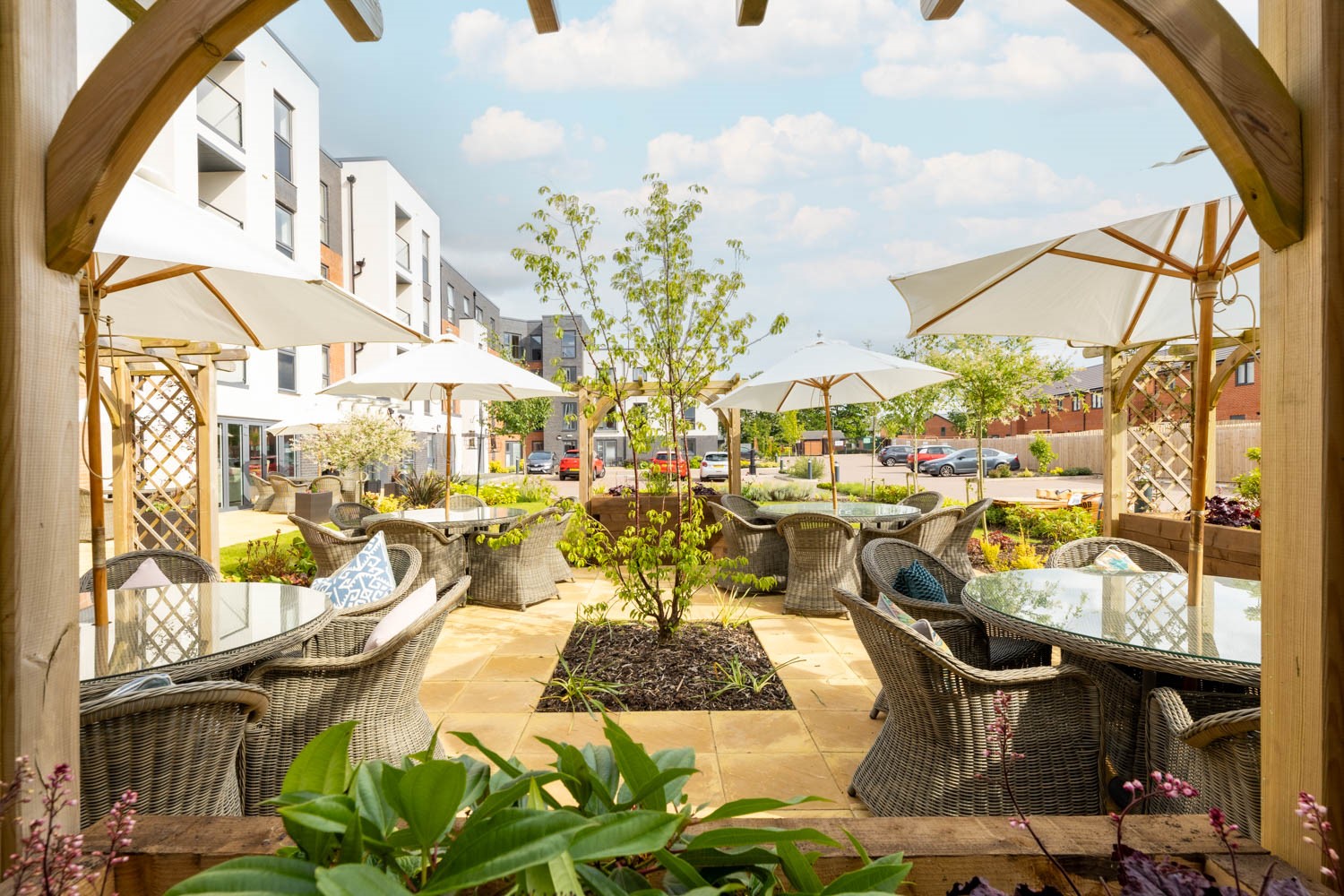 a patio with umbrellas and chairs
