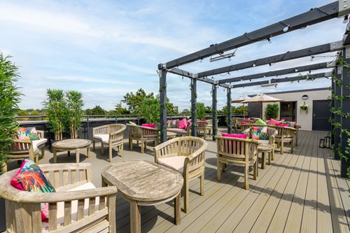 a deck with chairs and tables