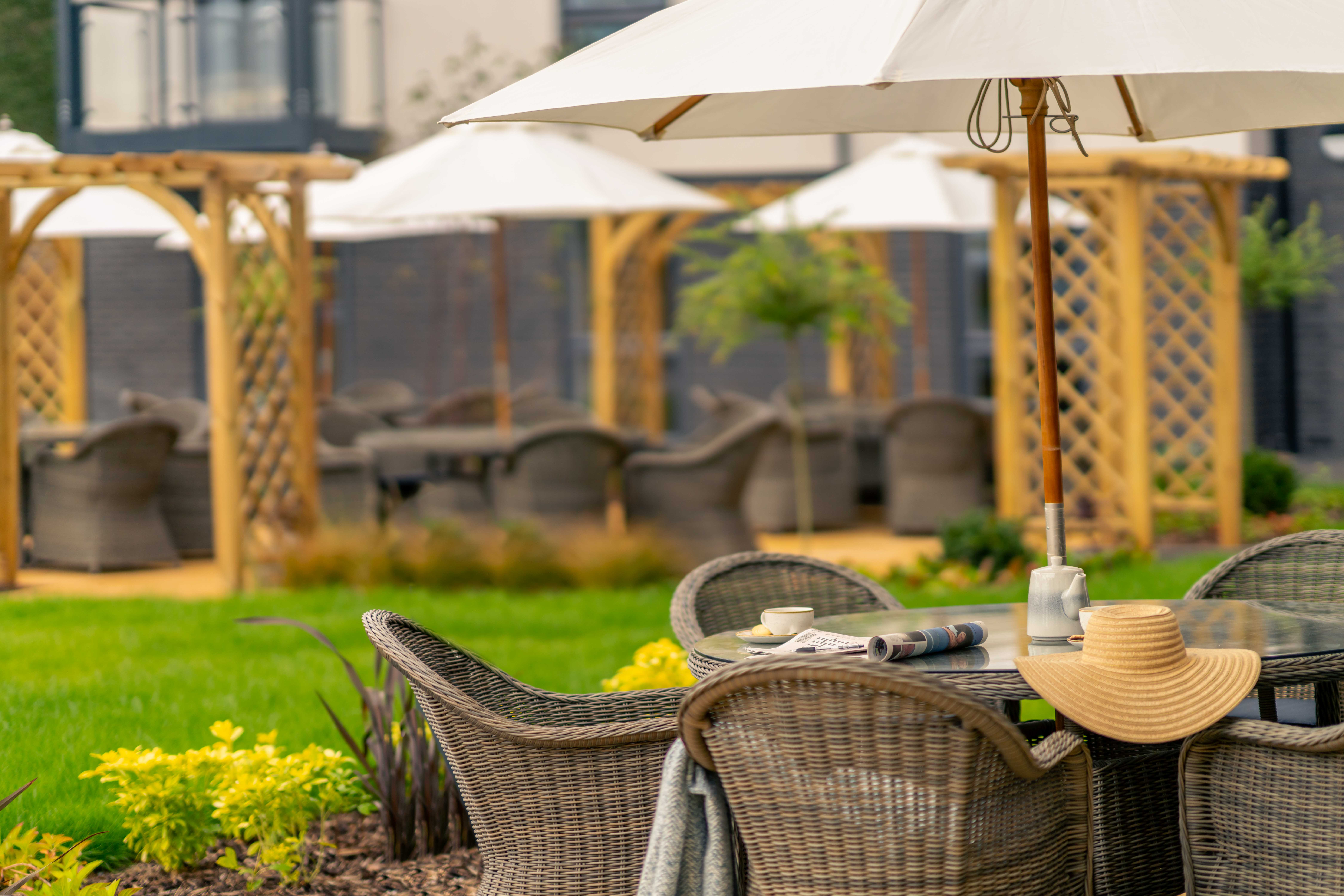 a table with chairs and umbrellas