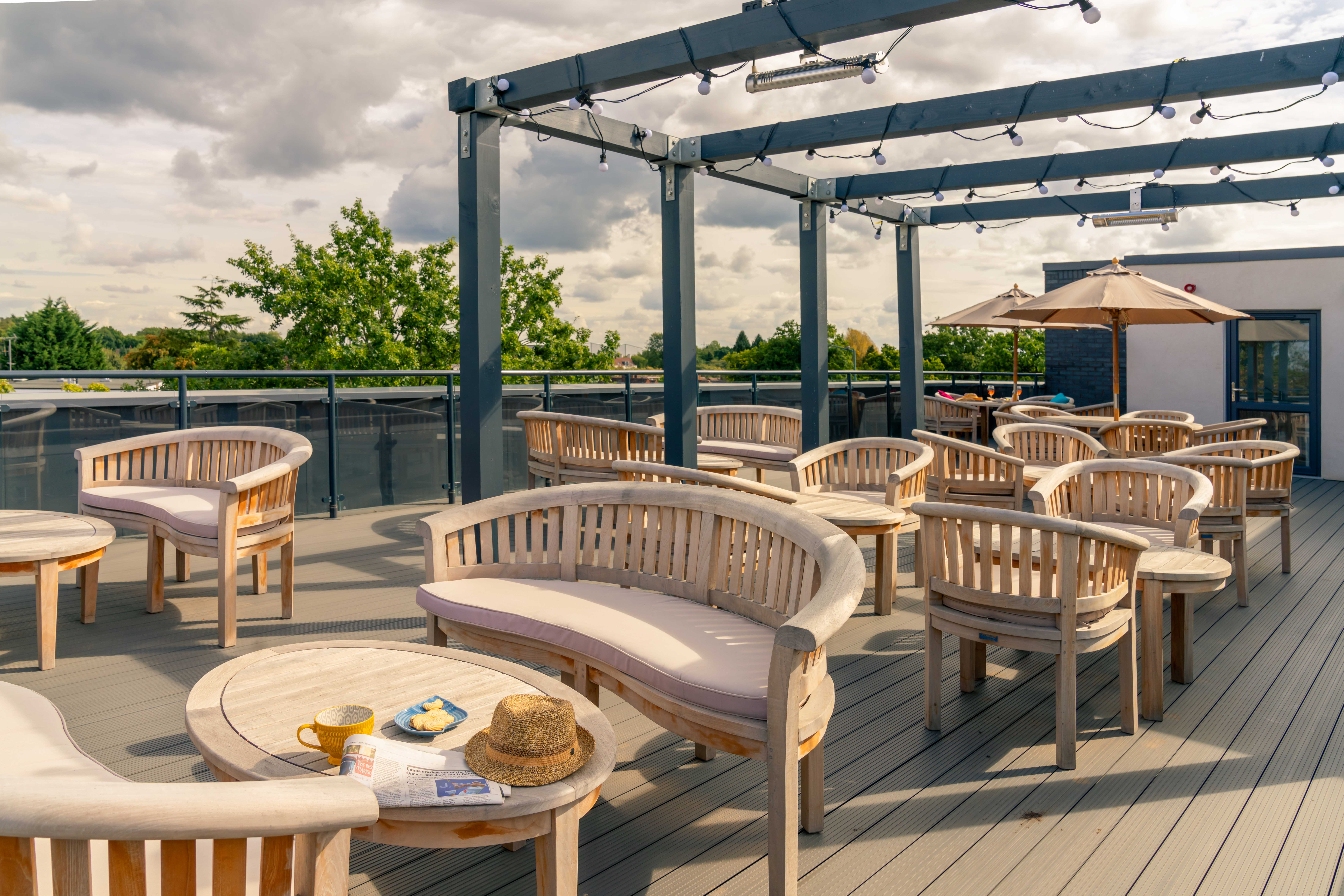 a patio with tables and chairs