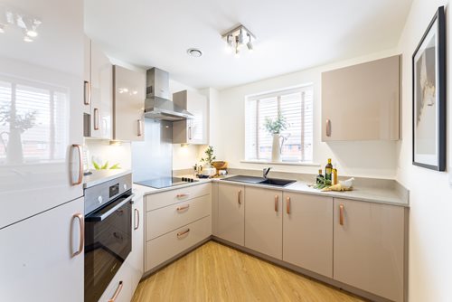 a kitchen with white cabinets
