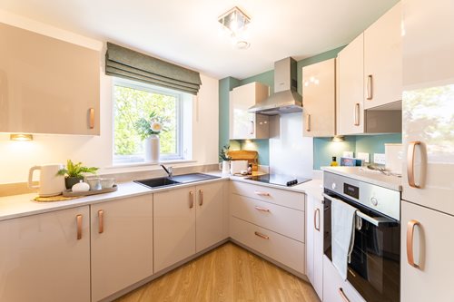a kitchen with white cabinets