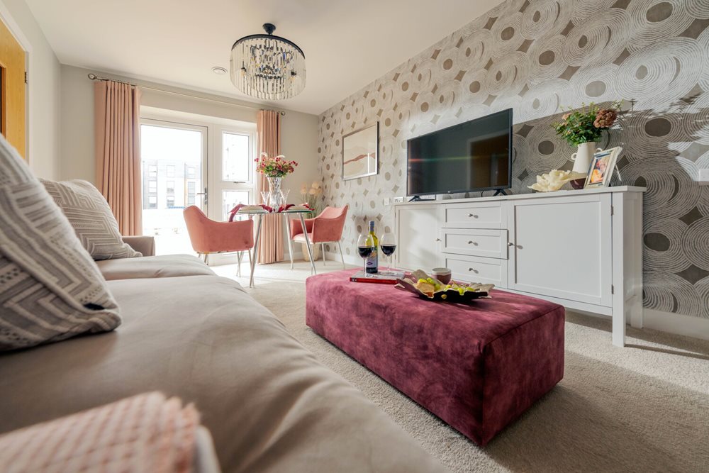 a bedroom with a bed and a tv