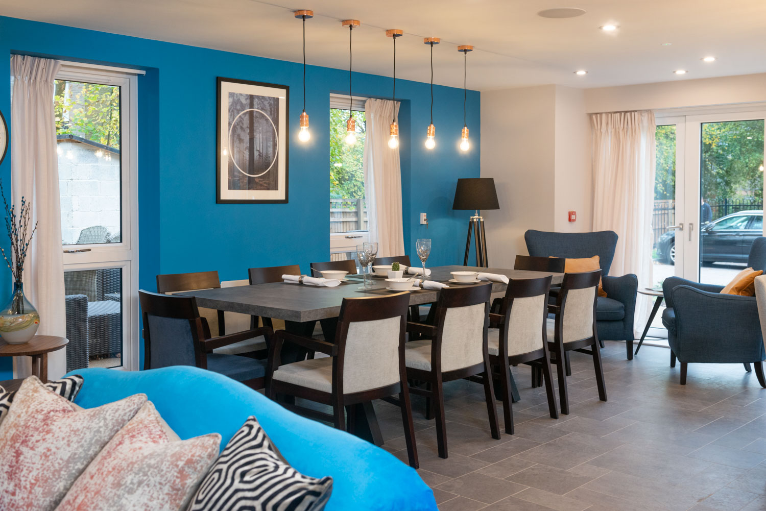 a dining room with a table and chairs