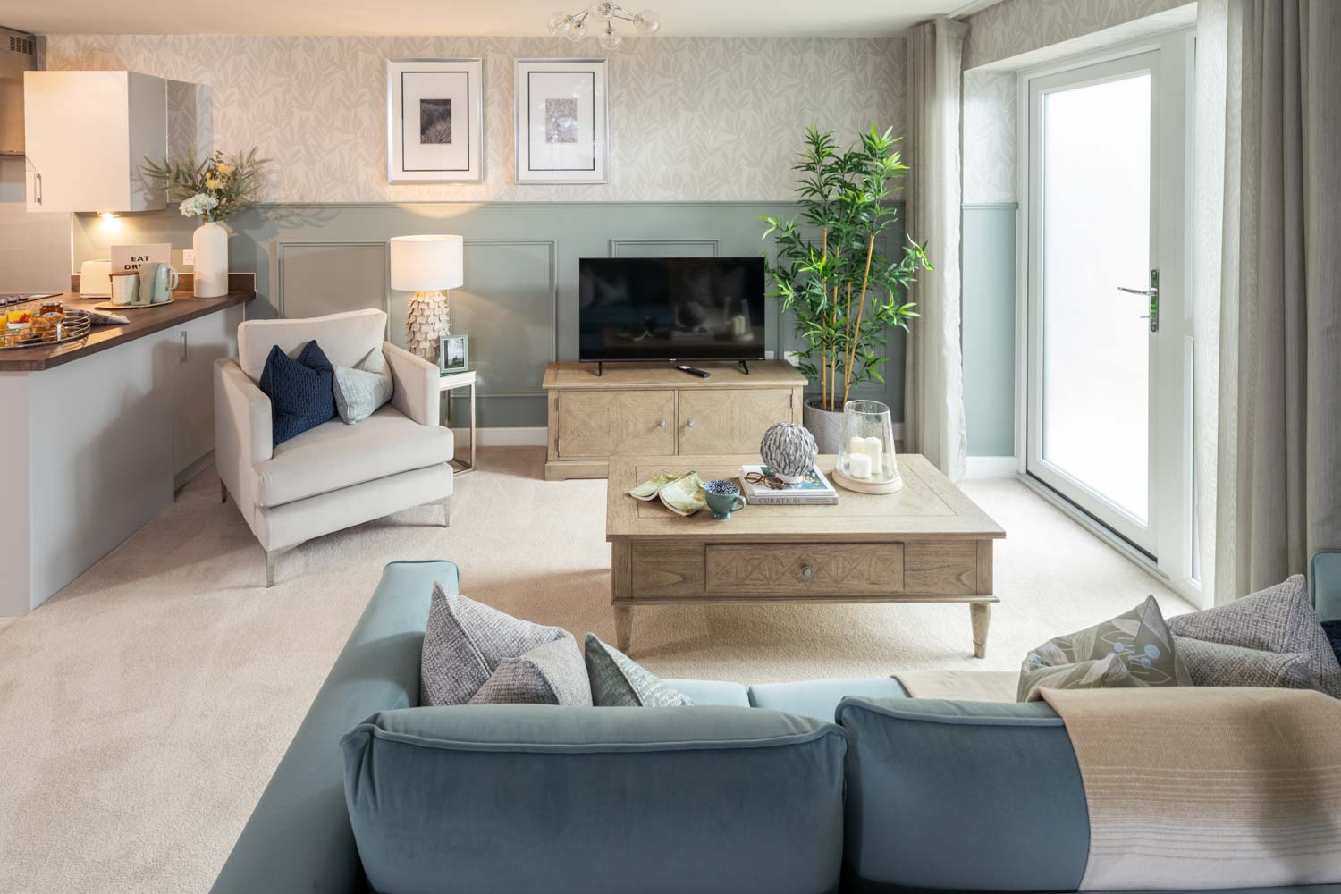 a living room with a tv and couches