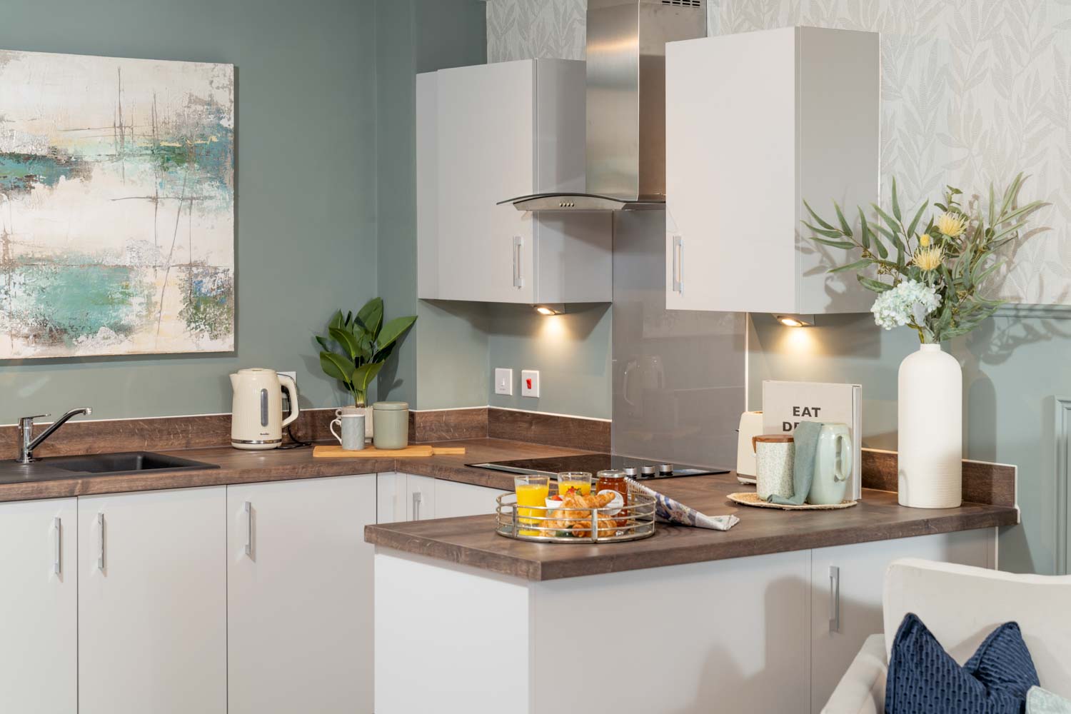 a kitchen with white cabinets