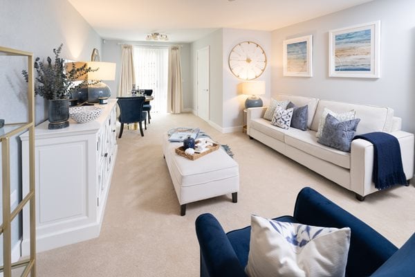 a living room with blue couches