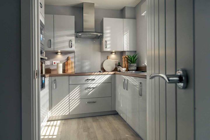 a kitchen with white cabinets