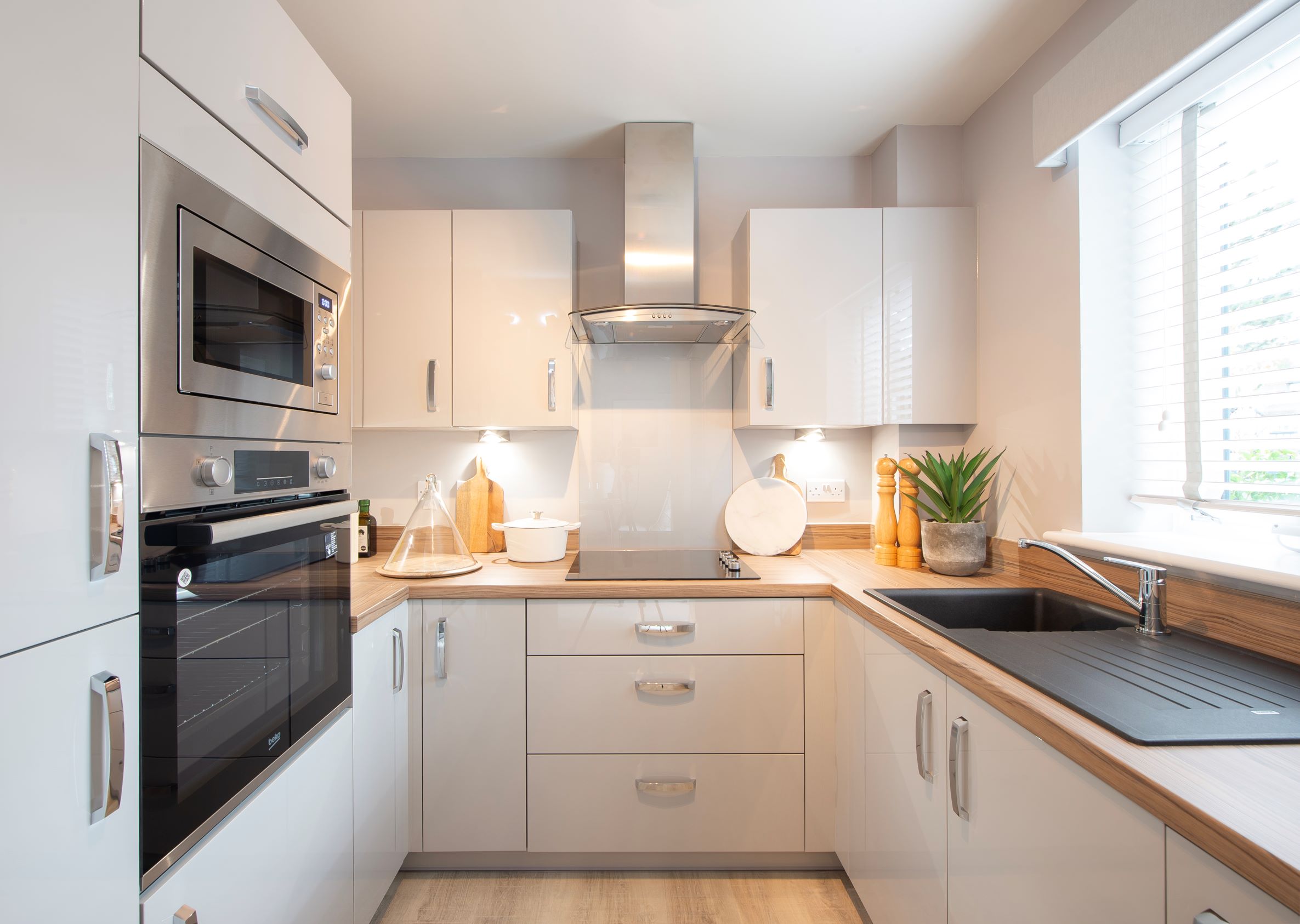 a kitchen with white cabinets