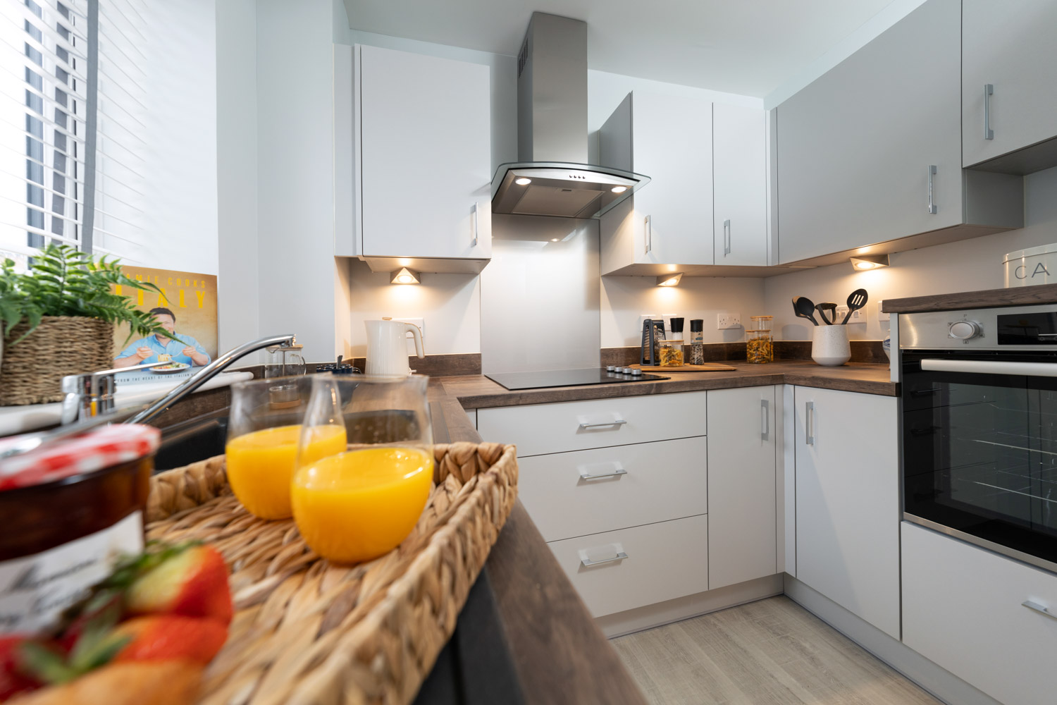 a kitchen with white cabinets