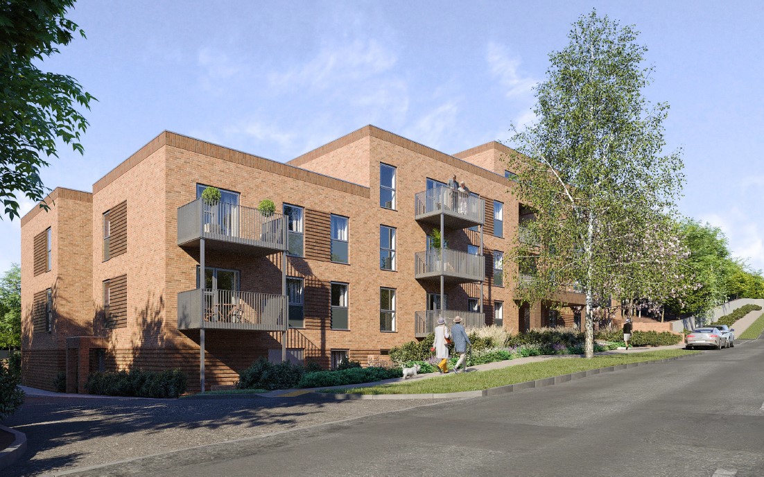 a large brick building with trees and people walking on the sidewalk