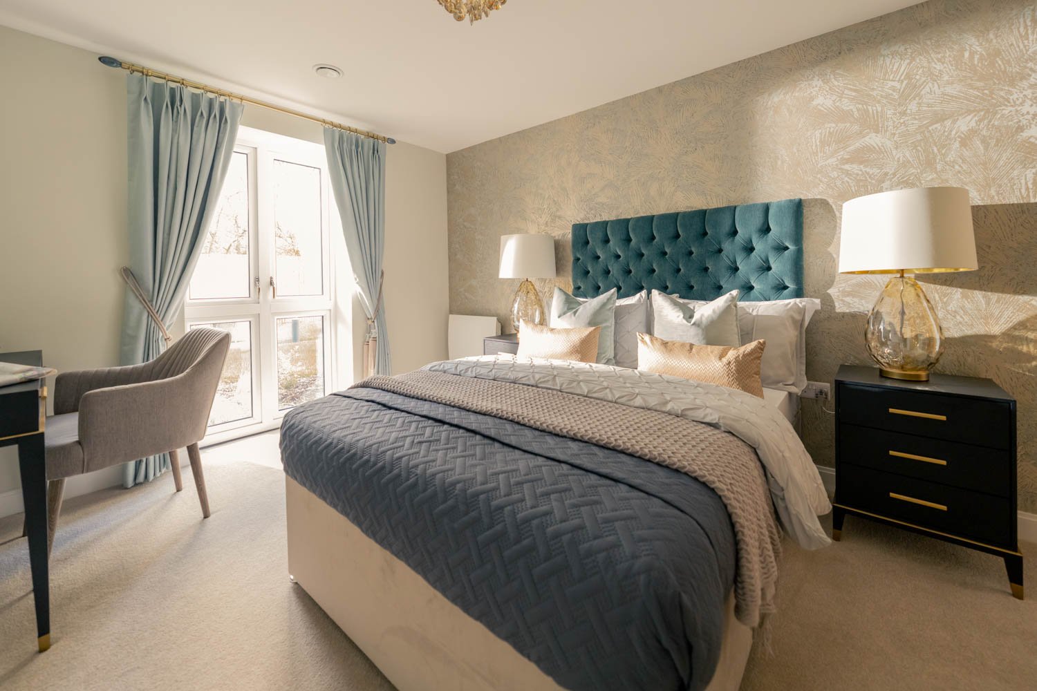 a bedroom with a bed and a chair