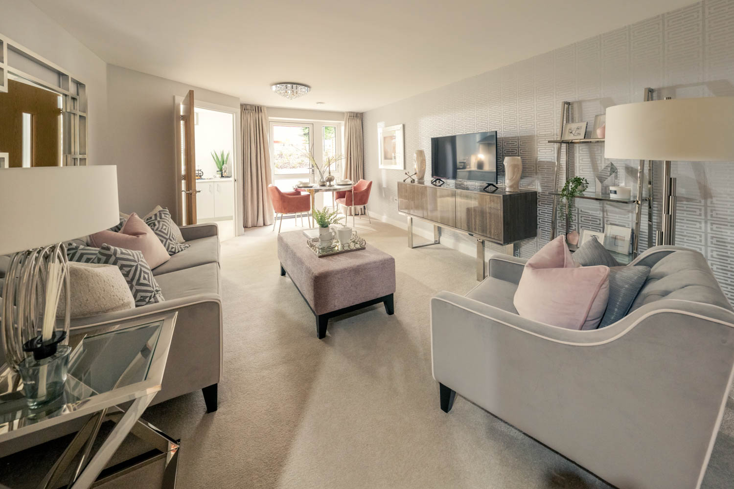 a living room with a large sofa and a television