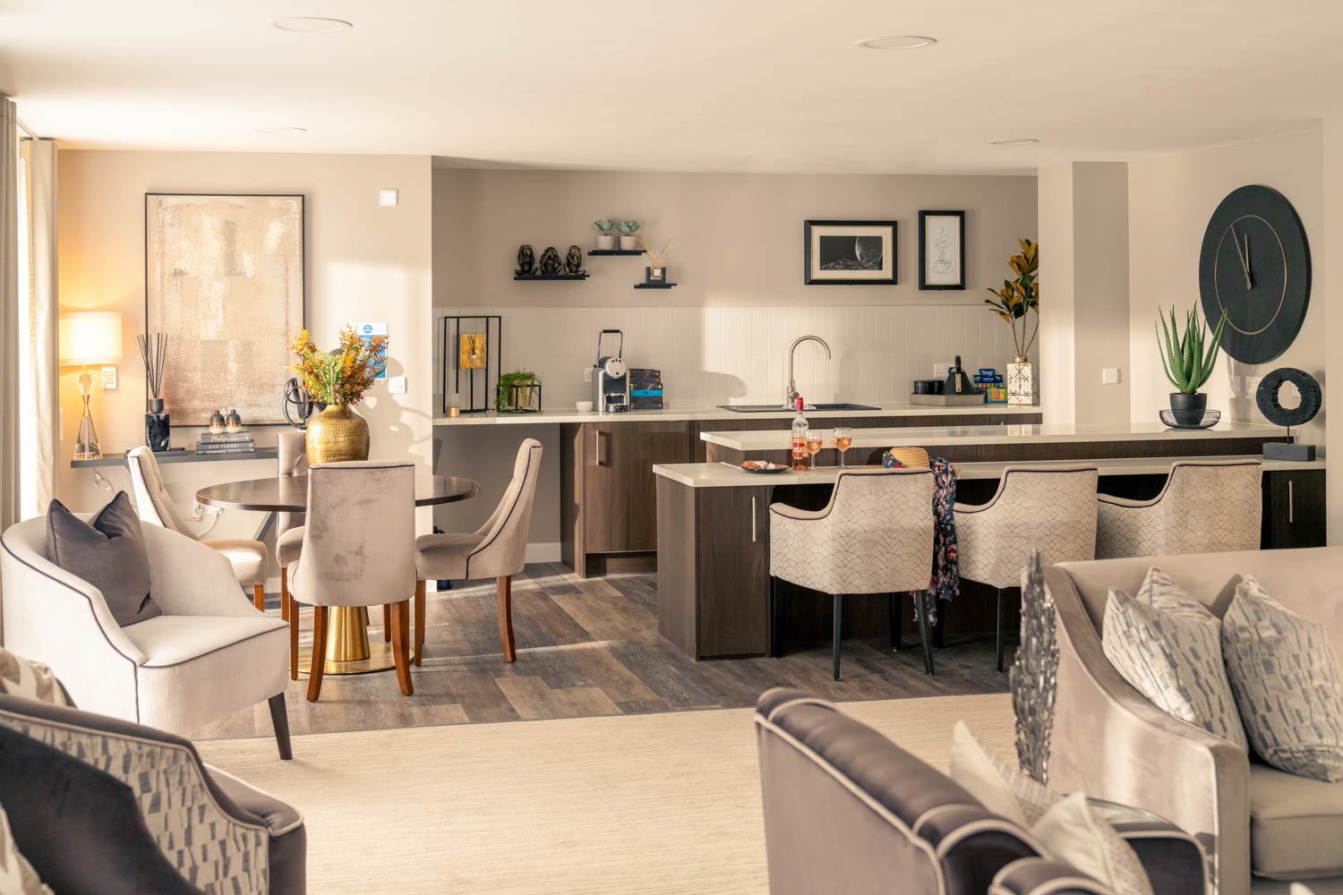 a large living room with white furniture