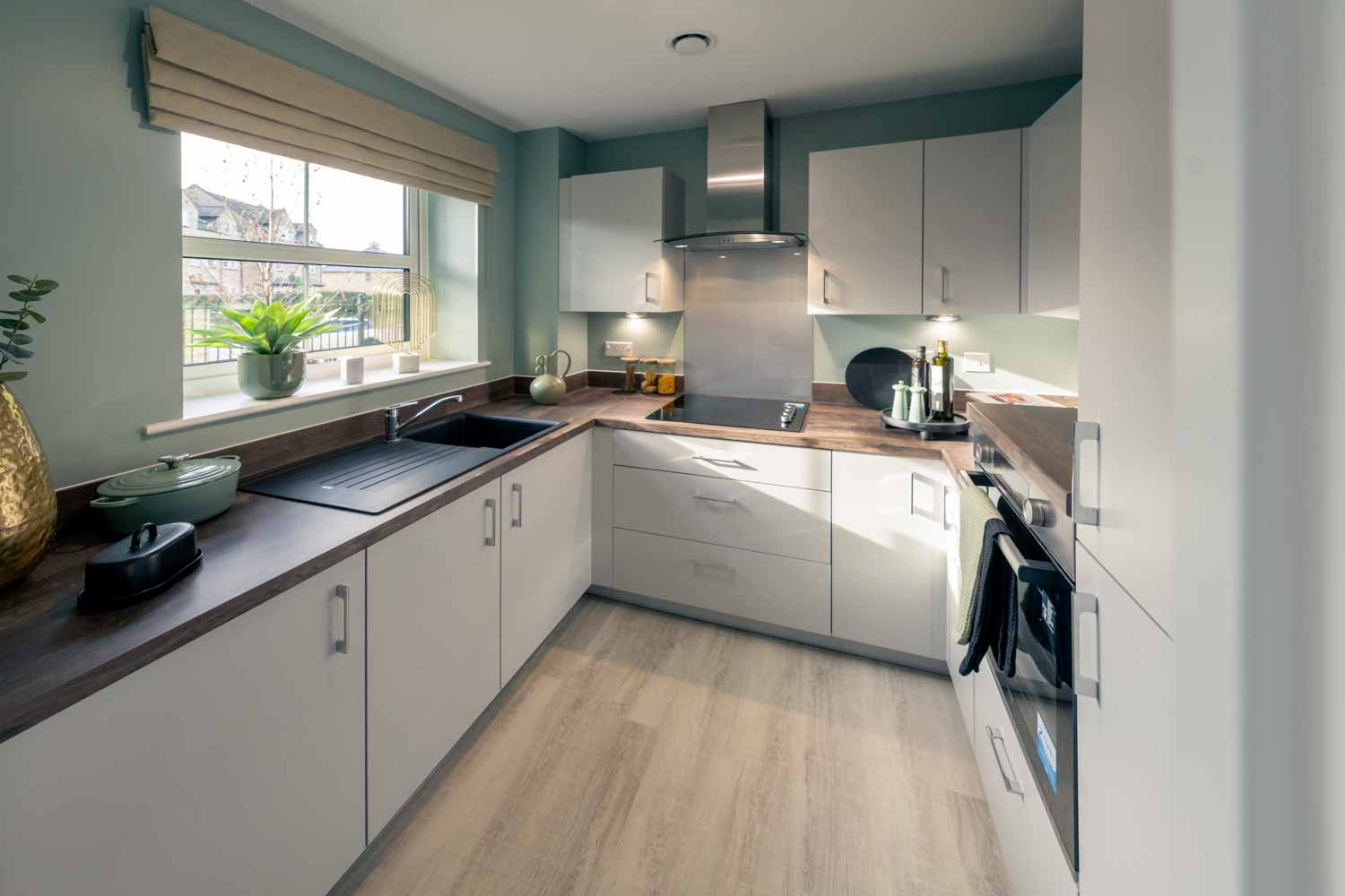 a kitchen with white cabinets