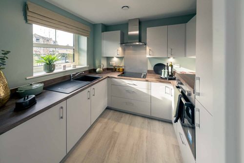 a kitchen with white cabinets