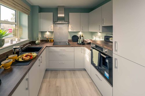 a kitchen with white cabinets